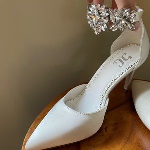 Beautiful satin white shoes with rhinestone detail at the ankle.